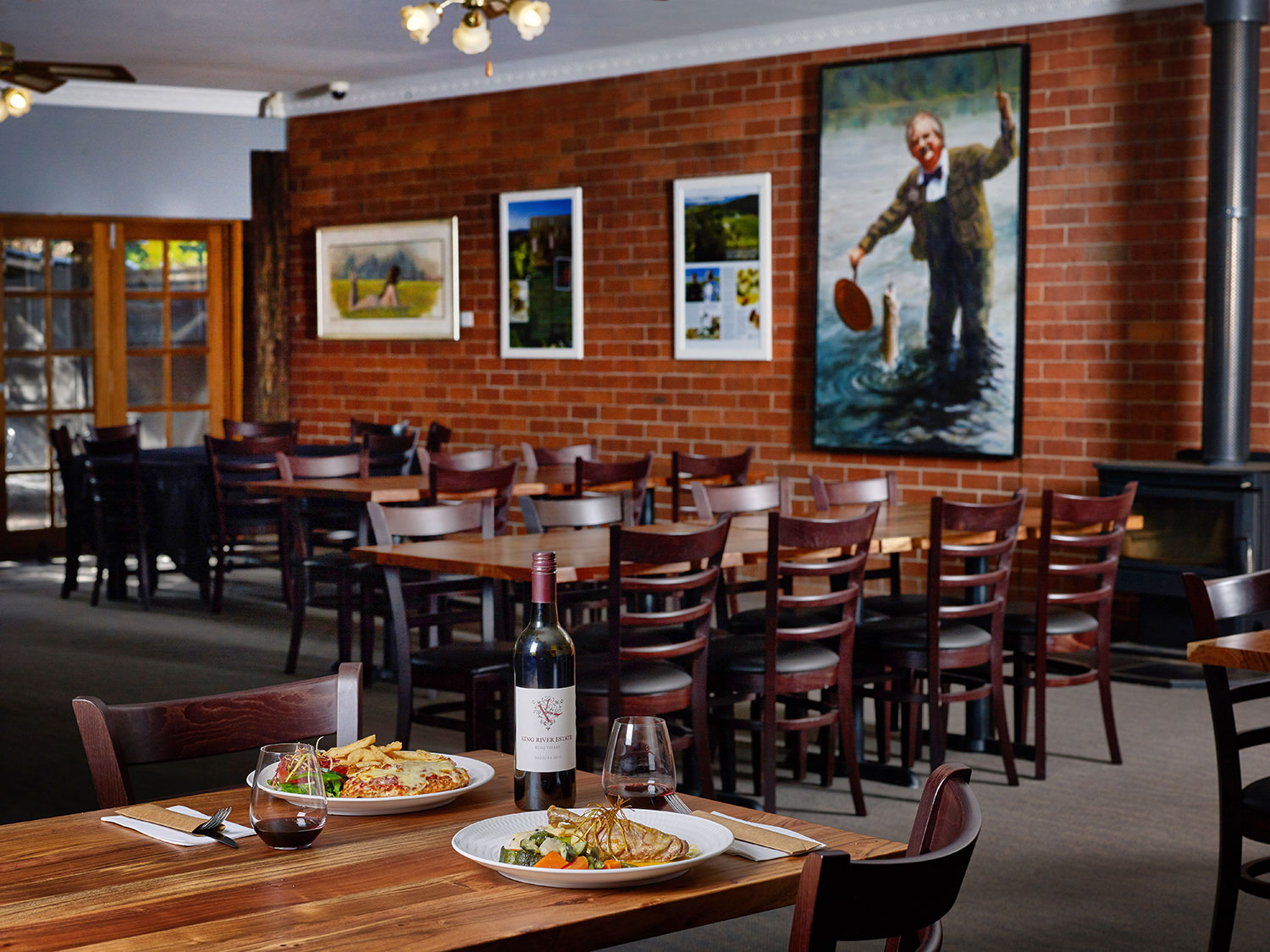 A portrait of Australian chef Tony Bilson hangs in the main dining room